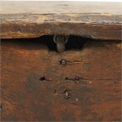 Small 17th century six plank oak coffer, figured top with iron pintle type hinges,  pegged boarded sides, large lock plate with rivets, plank ends continuing down as supports