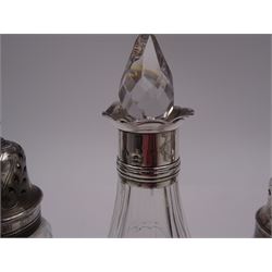 Late 18th century silver cruet stand, of oval form, with pierced sides upon four bun feet, hallmarked to handle Hester Bateman, all other hallmarks indistinct, together with five matched silver mounted cut glass cruet bottles, including some later Victorian examples, hallmarks predominantly indistinct, stand H20cm