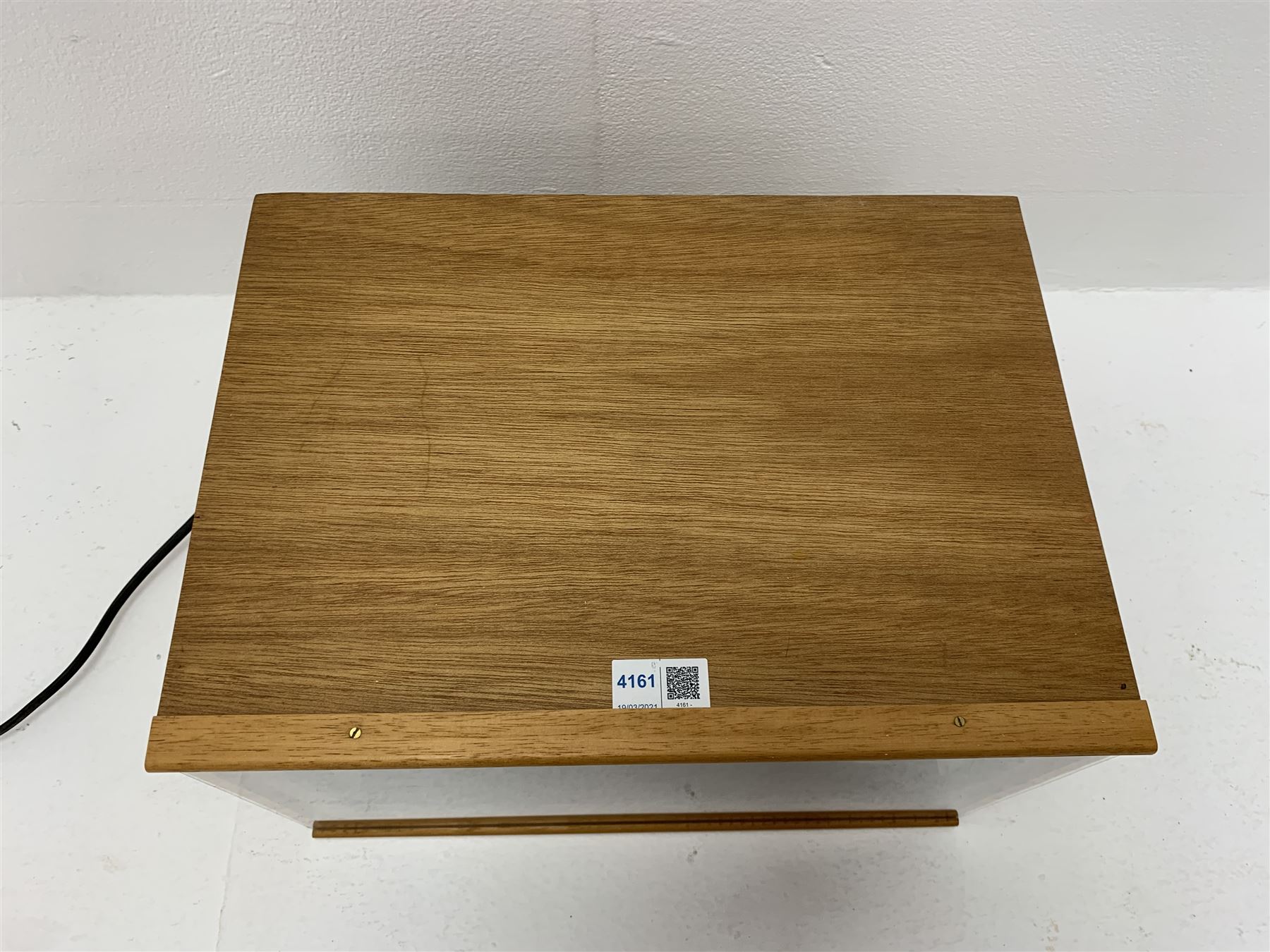 Dolls house scale room setting of a public house bar with tiled floor and beam and plaster ceiling and walls, bench seat, stools and table set out with a meal and drinks, large planked finish canted bar well stocked with food, drinks, bottles, glasses etc and bartender figure behind; electrically illuminated with sliding perspex access panel to front W38cm D28cm H24cm