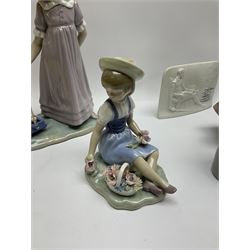 A group of nine Lladro figures, comprising three geese, seated girl with flowers, girl holding oranges, etc., each with printed marks beneath. 