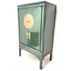 Chinese 'moon' rosewood raised cabinet, hammered brass centre piece featuring floral design, two cupboard doors enclosing two tiers and two short drawers, above two short drawers, shaped trim and stile supports 