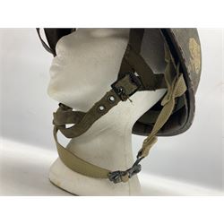 American first type paratrooper helmet with post-WW2 strap and D-rings and later 1944 liner bearing Firestone Tyre and Rubber Company mark; green textured finish