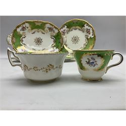 Coalport green batwing pattern tea wares, decorated with finely enamelled floral sprays within gilt reserves, comprising teacup trio, twin handled cake plate and side plate, pattern no Y2665, together with a Coalport for Harrods cup and saucer similarly decorated, the saucer with stamped mark beneath 'Manufactured for Harrods Ltd, Brompton Rd London', all with green Coalport AD 1750 marks beneath, largest W31cm (7)