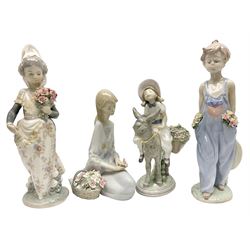 Four Lladro figures, comprising Look at Me, no 5465, Pocket Full of Wishes, no 7650, Valencian Girl no 1304, and Flower Songs no 7607, H26cm