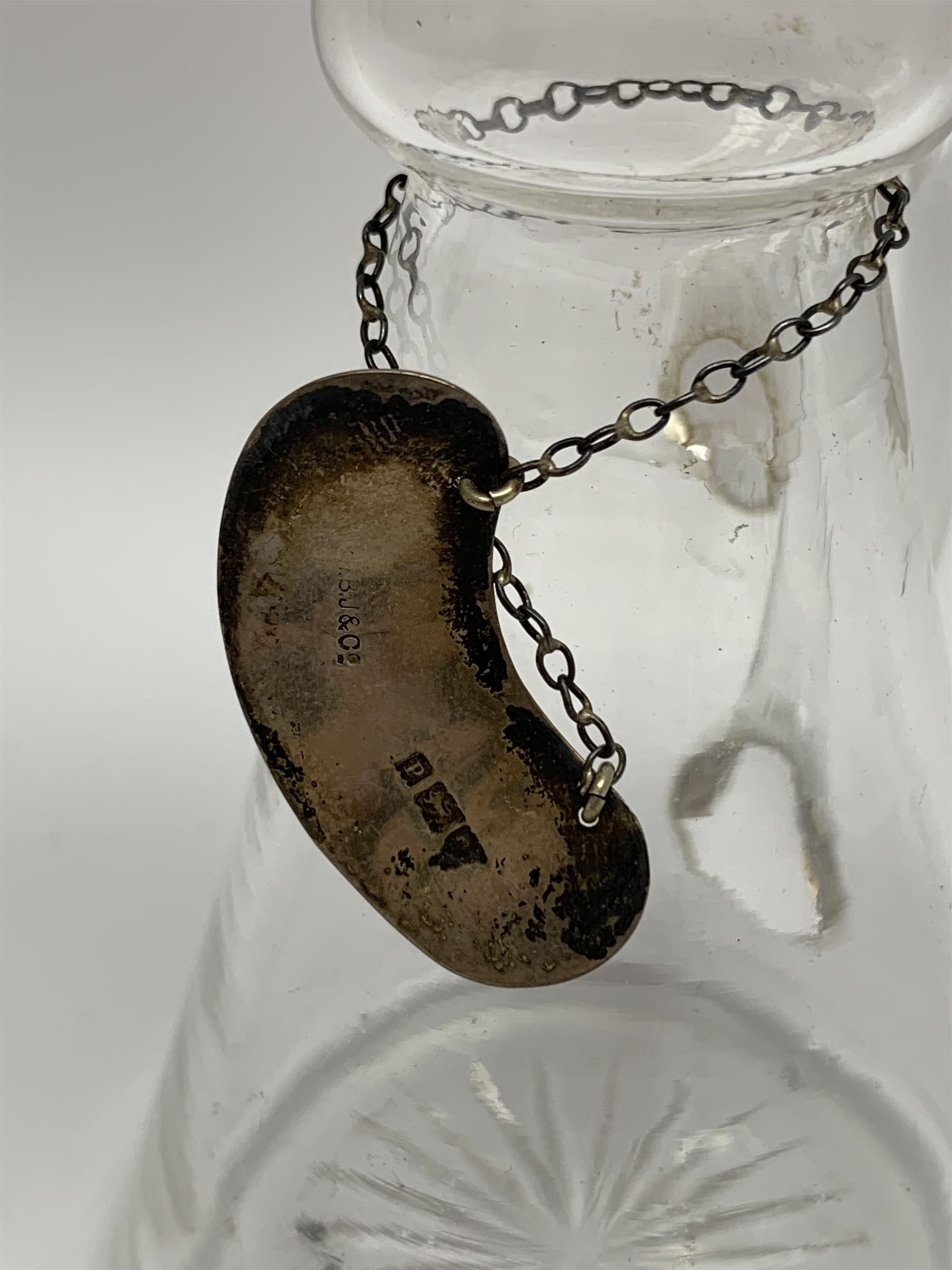 Edwardian silver mounted whisky noggin, of tapering cylindrical form with hinged flat cover, H12cm, together with a silver whisky label, each hallmarked H B Johnson & Co, London, whisky noggin dated 1906, label 1910