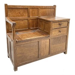 'Acornman' figured oak telephone table, panelled back above hinged seat and two drawers, panelled sides and front, all over adzing, by Alan Grainger of Brandsby, York