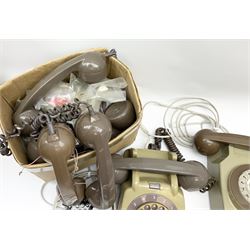 Collection of vintage telephones and spare parts including handsets.  
