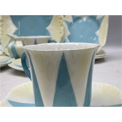 Shelley Dainty pattern tea wares, of lobed form with blue star decoration on merging white and yellow ground, comprising five teacups, five saucers, six tea plates, milk jug and cake plate, all with printed green mark beneath, some with painted pattern no 11770