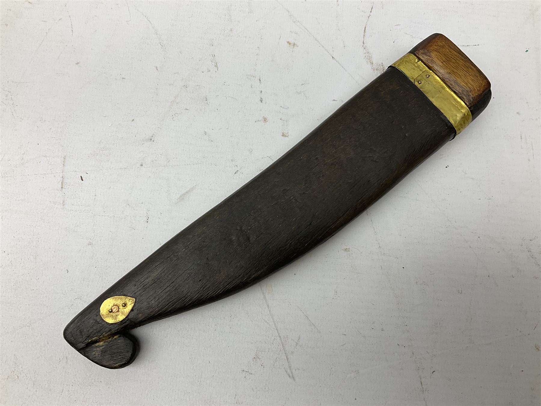 19th century Singhalese knife pia kaetta, the 20cm steel blade inset with yellow and white metal, with metal mounted carved pistol grip, in plain wooden scabbard L33cm overall