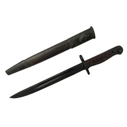 Australian Owen sub-machine gun bayonet, the 25.5cm fullered steel blade marked '53'; in metal bound wooden scabbard marled MA53 L41cm overall