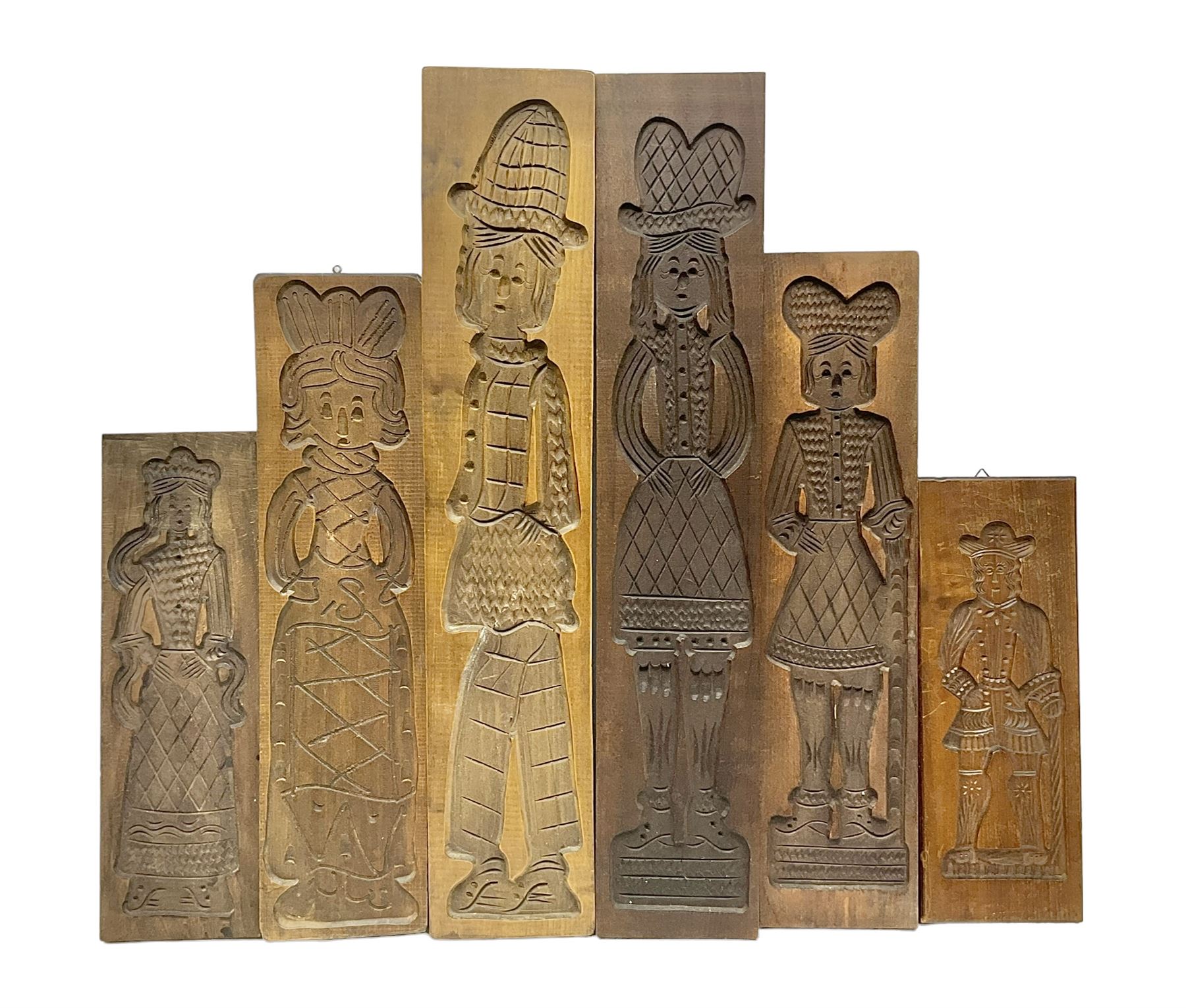 Six 20th century hardwood Dutch folk art Speculaasplank or biscuit moulds, typically carved with figures in traditional dress, largest H101cm