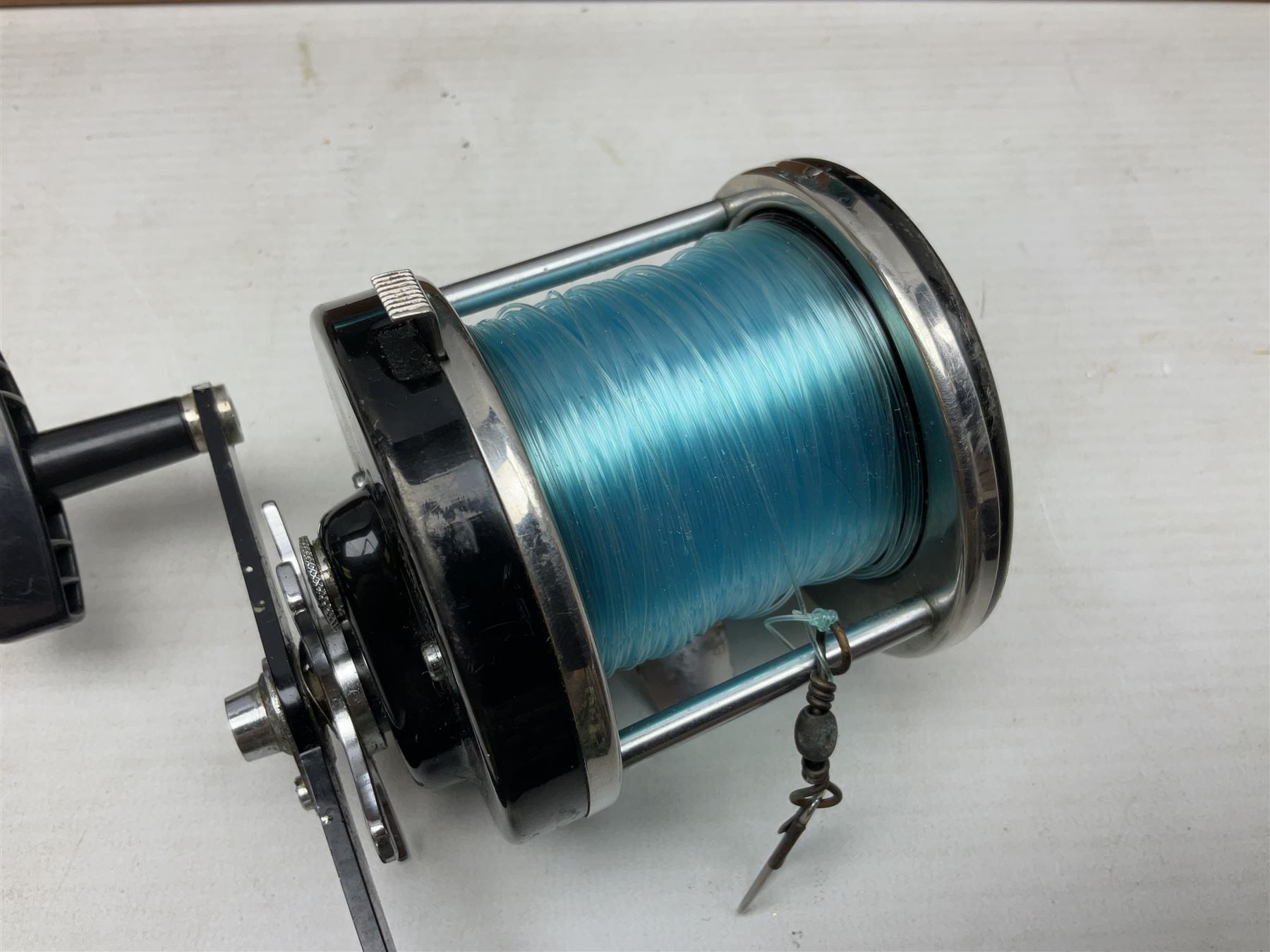 Four Abu fishing reels, comprising Ambassadeur 9000, Ambassadeur 7000, Ambassadeur 5500 and Ambassadeur 6500, together with additional line, hardy fishing bag and two wooden boxes