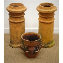  Two terracotta chimney pots (H73cm) and a smaller chimney pot  