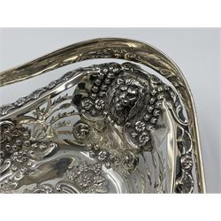 Edwardian silver swing handled basket, of navette form, with four repousse lion masks to each corner and with pierced and embossed floral, scroll and shell decoration to sides, base and handle, hallmarked Charles Horner, Birmingham 1906, height including handle H20cm