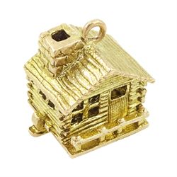 9ct gold articulated chalet pendant / charm, opening to reveal a ice axe and rope, hallmarked 