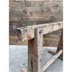 Pair of late 19th century pitch pine trestles, square tapering form in stripped finish