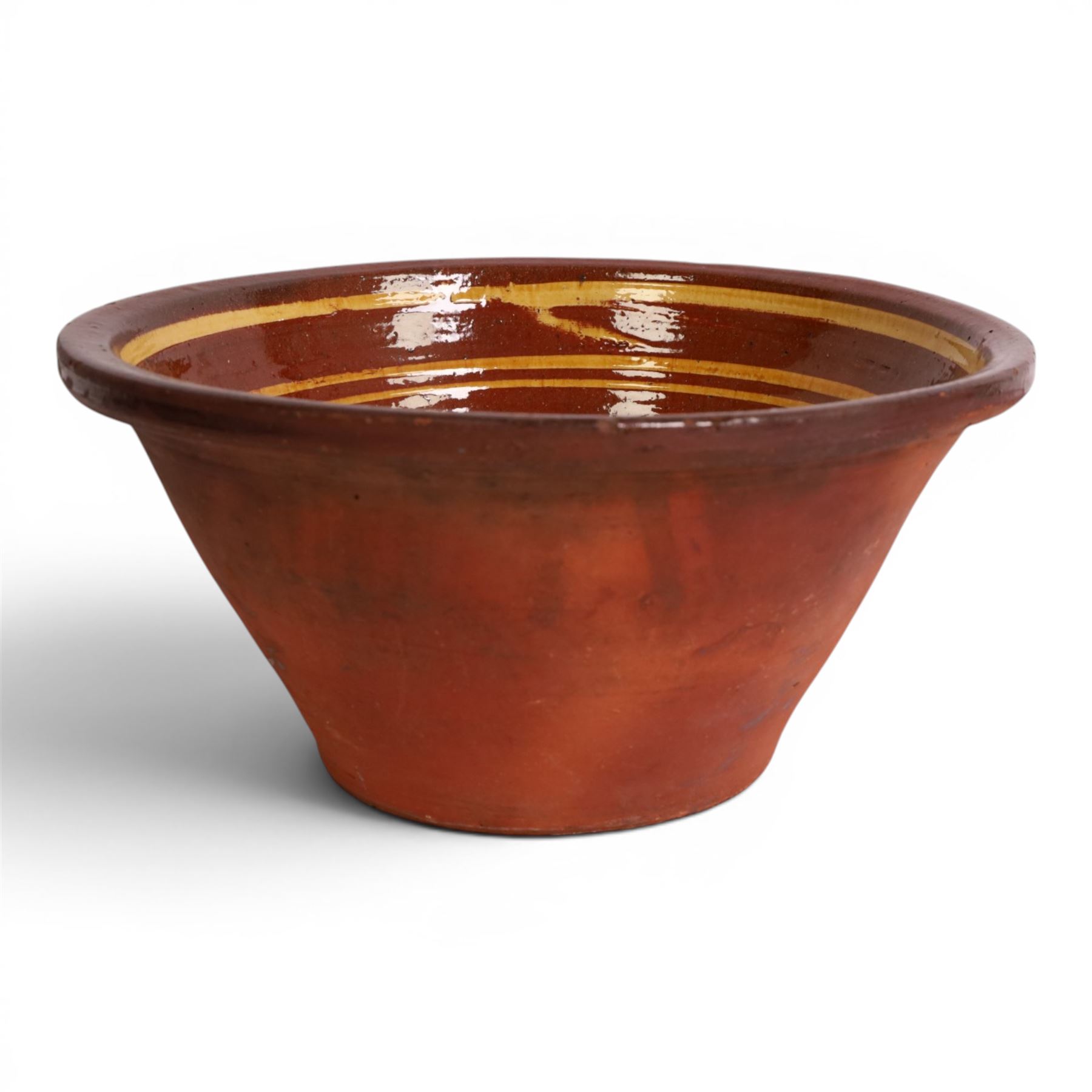 19th century terracotta bread pancheon, of circular form, the glazed interior with slip decoration, H21cm, D43cm