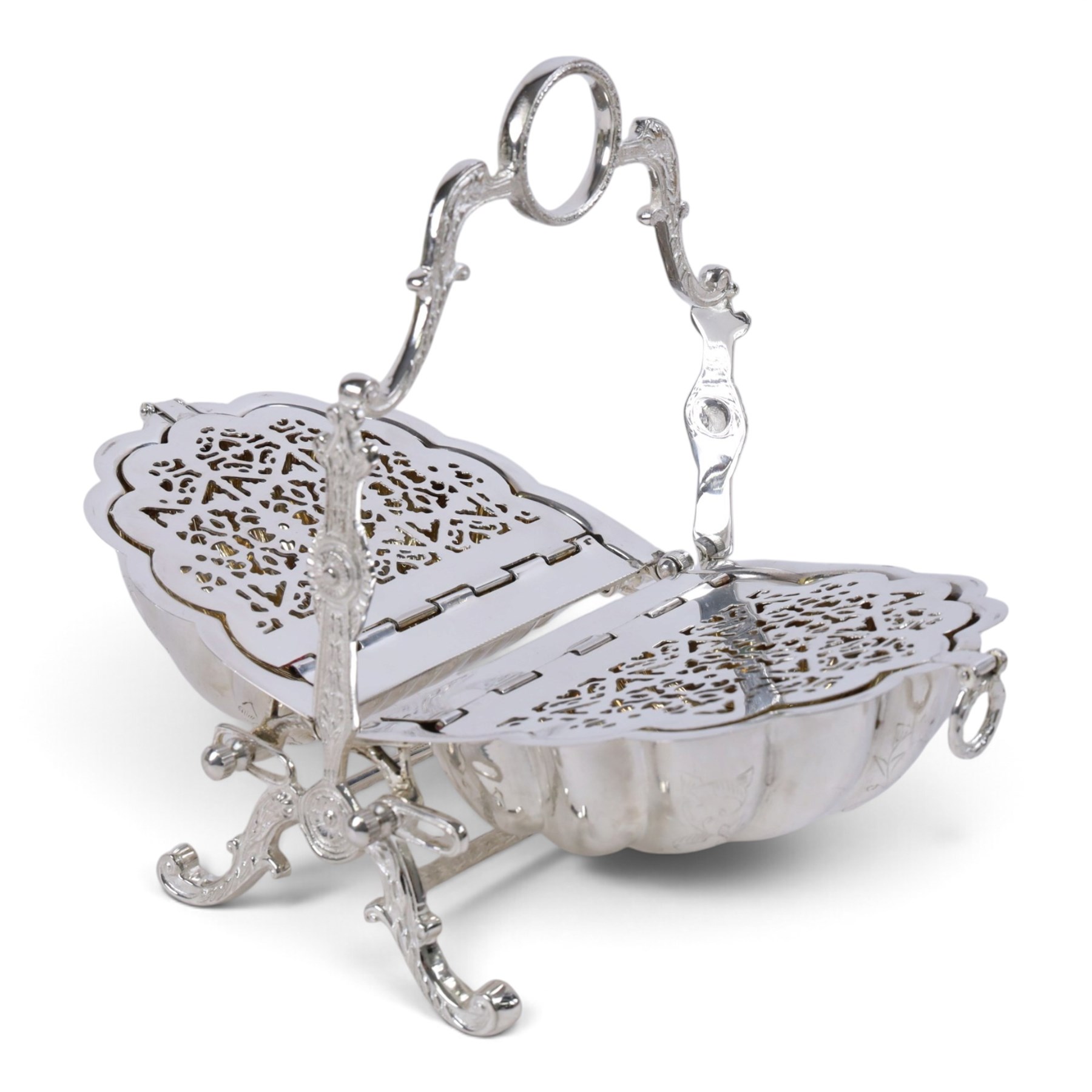 Silver-plated Victorian style biscuit box, in a shell form with engraved leaf detailing, upon scroll feet, H24cm