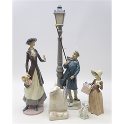  Collection of Lladro figures comprising Lamplighter, H48cm, Tokens of Love, Girl with Present, Lladro Society Poodle and Scroll plaque (5)  