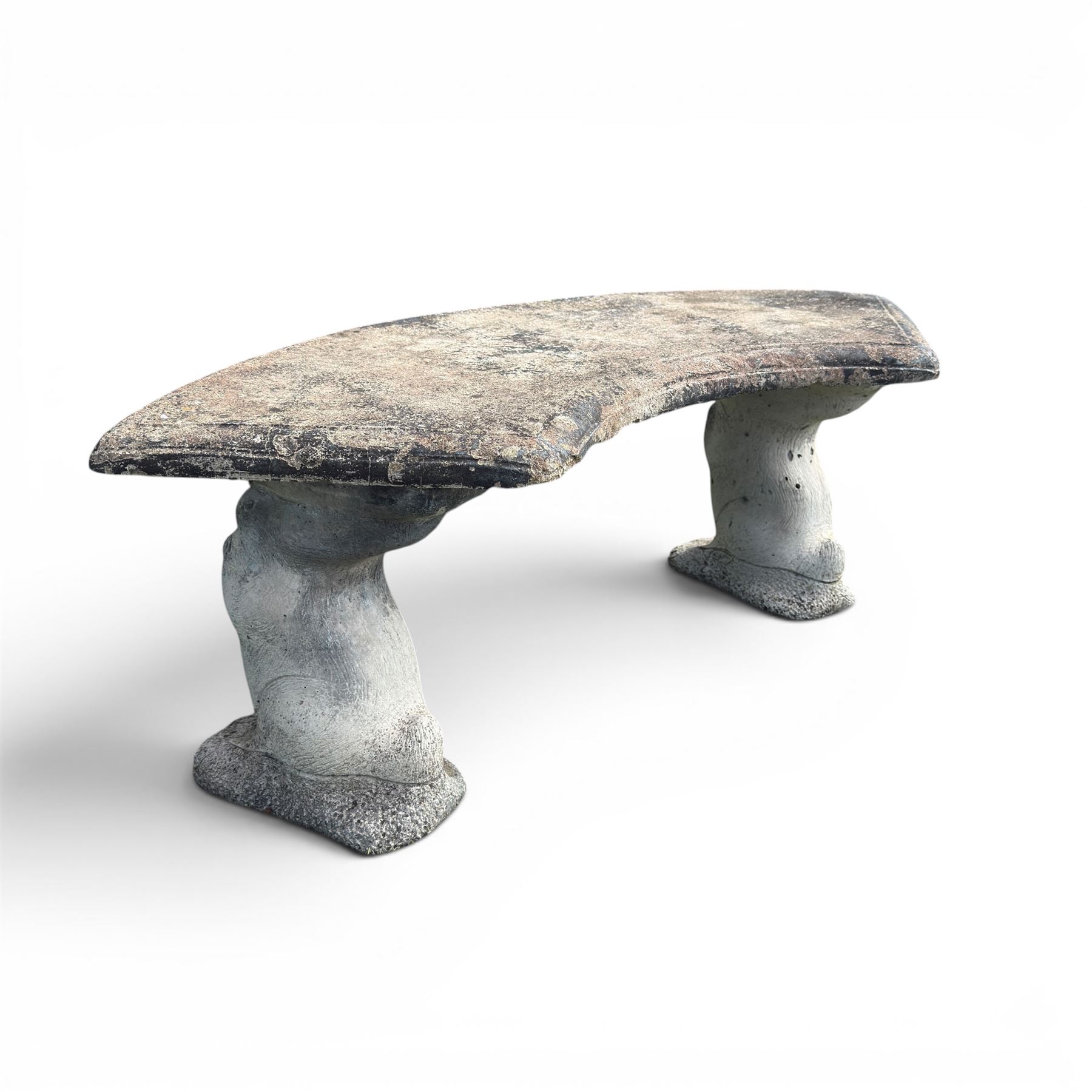 Weathered cast stone three-piece curved bench, raised on naturalist tree-stump style end supports