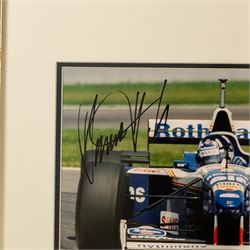 Ten signed Formula 1 photographs, comprising eight Damon Hill examples, Jenson Button and a Nigel Mansell example, nine with certificates of authenticity from Write Stuff Autographs, all framed, largest H47cm, W67cm