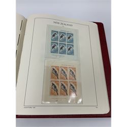 Mostly mint Queen Victoria and later New Zealand stamps, from 1873/92 newspaper stamps onwards with various early issues present, some higher values present, housed in two 'New Zealand' lighthouse albums and a 'Stanley Gibbons Commonwealth Stamp Catalogue New Zealand' 