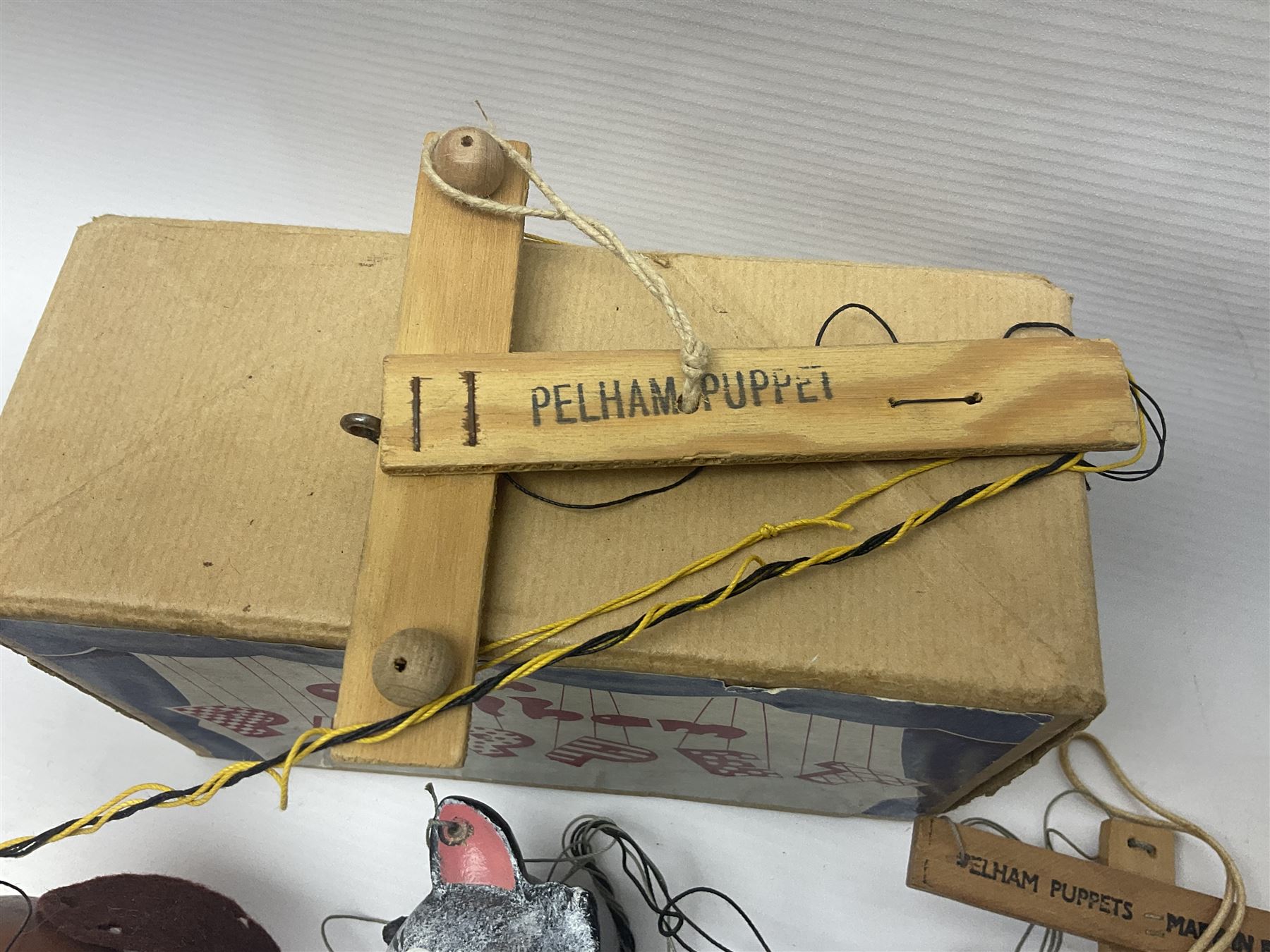 Pelham Puppet - three puppets comprising a painted wooden duck with felt mouth and wings with metal joints H12cm, in original box and instructions; and two further examples Type A cat with a hollow body H12cm, and a boy H23cm (3) 