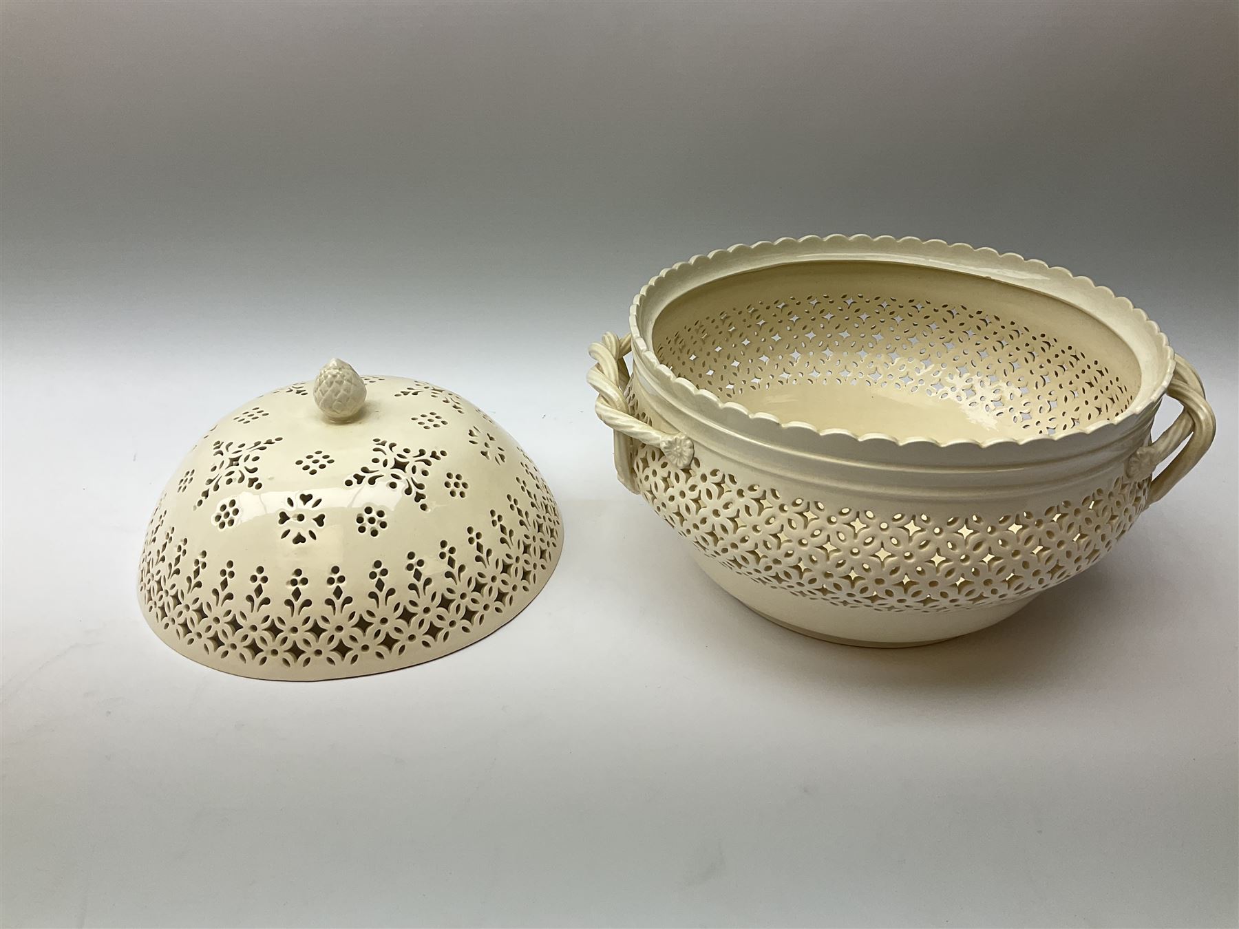 Large 20th century Leeds pottery basket and cover, of bulbous form with pierced detail and twin rope handle, with impressed mark beneath, H23cm D25cm