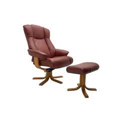 Mid-20th century design reclining armchair with swivel action, upholstered in red leather, raised on U-shaped supports with quadruform base, with matching footstool
