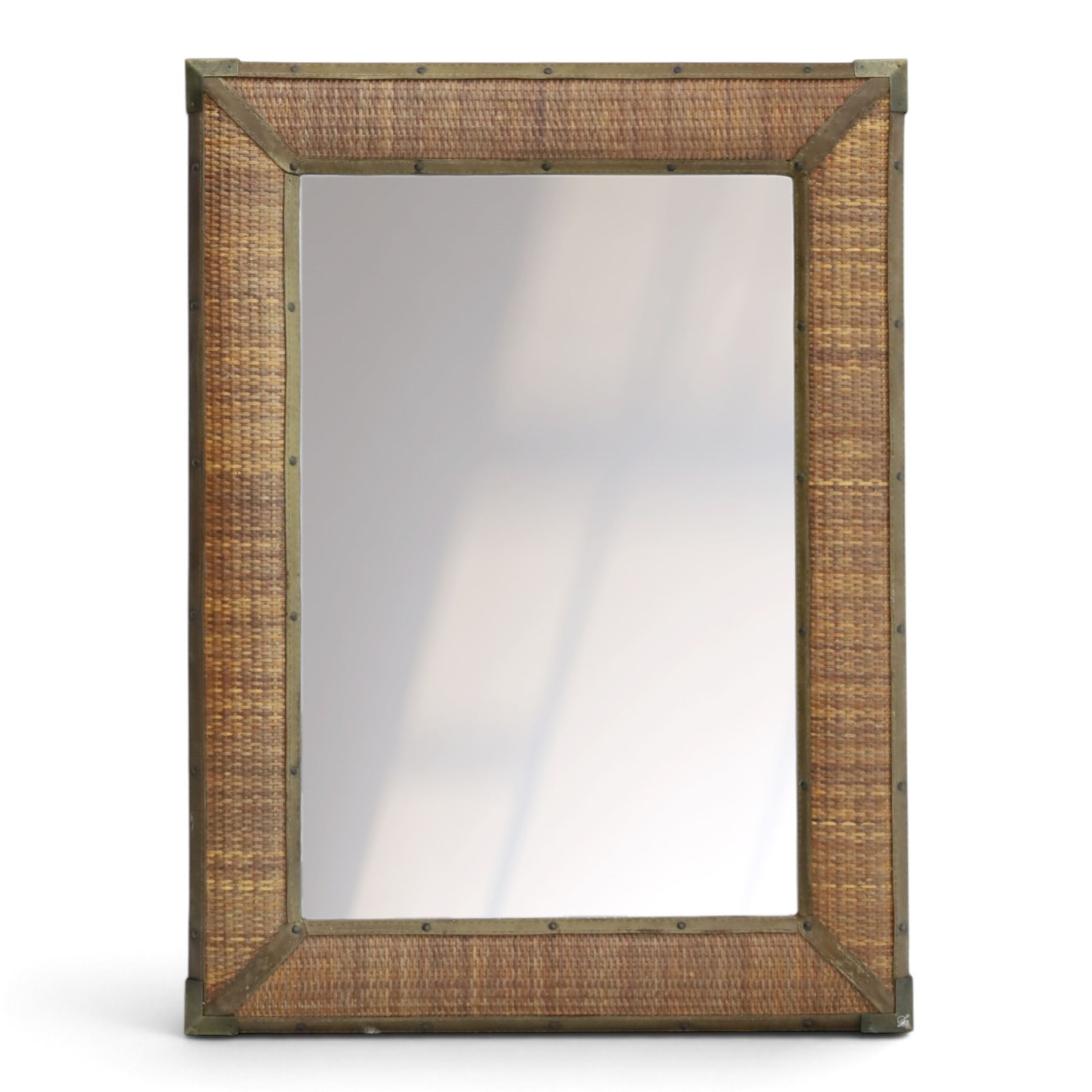 Rustic wall mirror with brass, leather and rattan frame, enclosing a bevelled plate