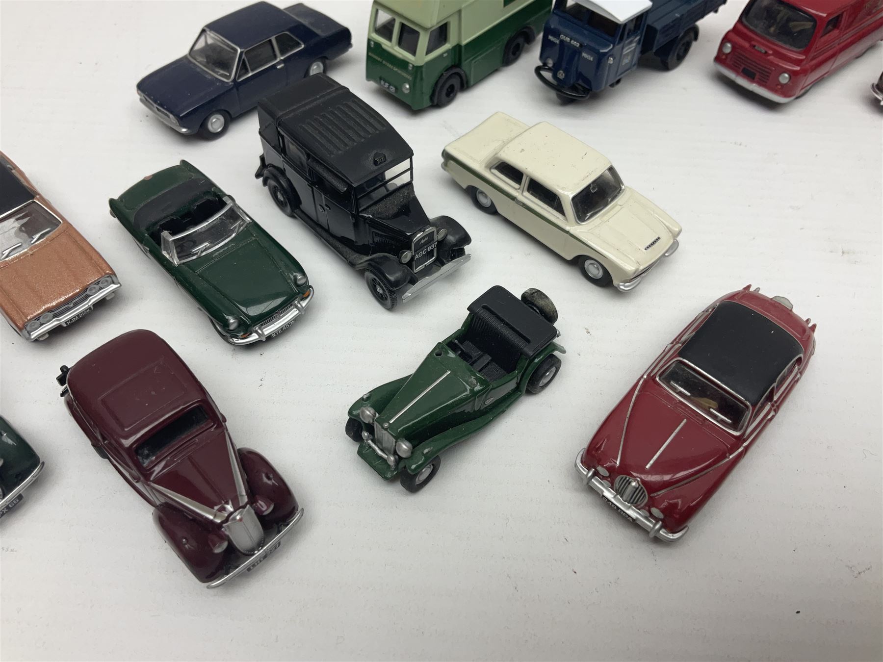 Over forty 1:76 scale die-cast models of cars and commercial vehicles; some boxed; and eight small scale models of motorcycles; all unboxed