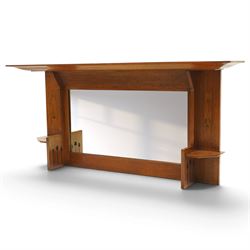 Manner of Liberty & Co, - Arts & Crafts inlaid oak overmantel mirror, the deep-projecting cornice over a rectangular plate, flanked by Art Nouveau marquetry panels of stylised tulip and foliate motifs, over a canted shelf and tulip-pierced upright