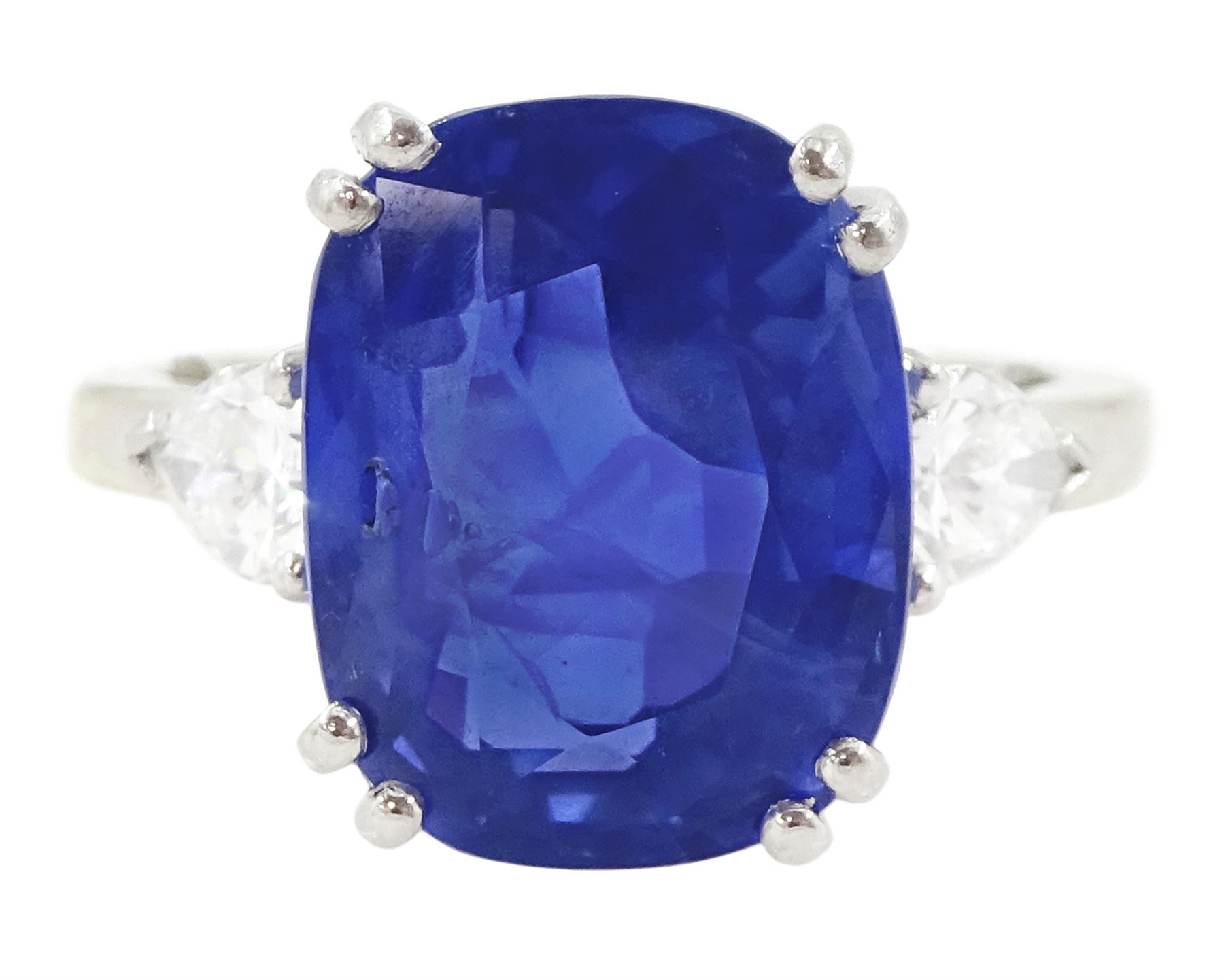French 18ct white gold and platinum three stone unheated Ceylon sapphire and diamond ring, the single mixed cushion cut sapphire of 8.49 carat, with Gem Paris report, flanked by pear cut diamonds, hallmarked, total diamond weight approx 0.60 carat