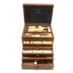  Dentistry - Late Victorian mahogany Dentists cabinet by C. Ash & Co, hinged cover above six long graduated drawers, enclosing a comprehensive arrangement of implements, pharmaceutical bottles, tools, modelling wax, porcelain teeth, 