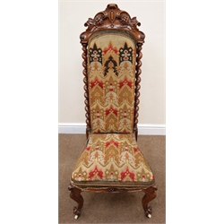  Victorian walnut framed needlework chair, shaped carved foliate cresting rail, upholstered back and seat flanked by barley twist columns, cabriole legs on castors, W53cm  