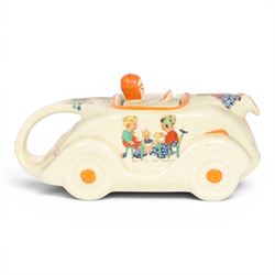 Sadler Art Deco teapot, modelled as a racing car with printed designs in the manner of Mabel Lucie Attwell, H10cm, L23cm