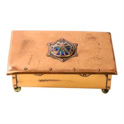  Arts & Crafts copper and enamel box, of rectangular form, the hinged lid with central enamel cabochon overlaid with pierced copper butterfly motif, raised on brass bun feet, H7cm, L17cm