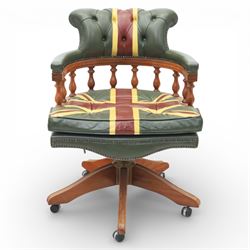 Late 20th century captain’s swivel desk chair, button upholstered back and seat in green leather with Union Jack motif panels, brass stud edging, curved padded arms with turned spindle supports, revolving and height adjustable action, on a five branch wooden base with castors