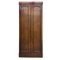 Victorian figured walnut single wardrobe, the moulded cornice with a central diamond motif over a pair of arched panelled doors with striking book-matched veneers, enclosing a fitted interior with hanging rail and hooks, on a plinth base