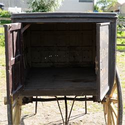 West of England Knitting Co. Ltd. Advertising Hand Cart

A rare and highly decorative late Victorian or Edwardian advertising hand cart, retaining its original black painted finish and gilt signwriting for West of England Knitting Co. Ltd., London, Penzance & St Ives. The enclosed box body is mounted on large cream painted wooden spoked wheels and fitted with rear push handles, allowing the cart to be manoeuvred by hand. Intended as a promotional and delivery vehicle for one of Britain's best known knitwear manufacturers, the cart survives as an evocative piece of commercial advertising history. The interior remains accessible via twin rear doors, while traces of the original maker's transfer for the Warwick Carrier are visible. An unusual and attractive display piece suited to collectors of advertising, transport memorabilia and social history.

Features

• Original hand painted gilt signwriting for West of England Knitting Co. Ltd.
• Advertising panels referencing London, Penzance and St Ives
• Enclosed wooden box body with twin rear access doors
• Original black painted finish with period lettering
• Large cream painted wooden spoked wheels with iron tyres
• Rear push handles for hand propelled operation
• Warwick Carrier maker's transfer remains visible
• Original undercarriage and running gear
• Attractive display piece with strong commercial advertising appeal
• Suitable for museum, retail, interior or collection display

Dimensions:
Overall length: 190 cm
Body length: 125 cm
Overall width: 140 cm
Body width: 100 cm
Height: 150 cm

Wheel Diameter:
Wheels: 92 cm