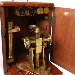 Late 19th/early 20th century Negretti and Zambra London brass microscope, with lenses, in mahogany travel case, together with a small brass field microscope and a set of prepared specimen slides