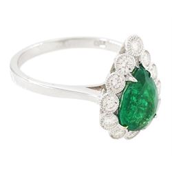 18ct white gold emerald and diamond cluster ring, single pear cut emerald of approx 1.40 carat, surrounded by twelve round brilliant cut diamonds, in a milgrain setting, stamped 750, total diamond weight approx 0.55 carat