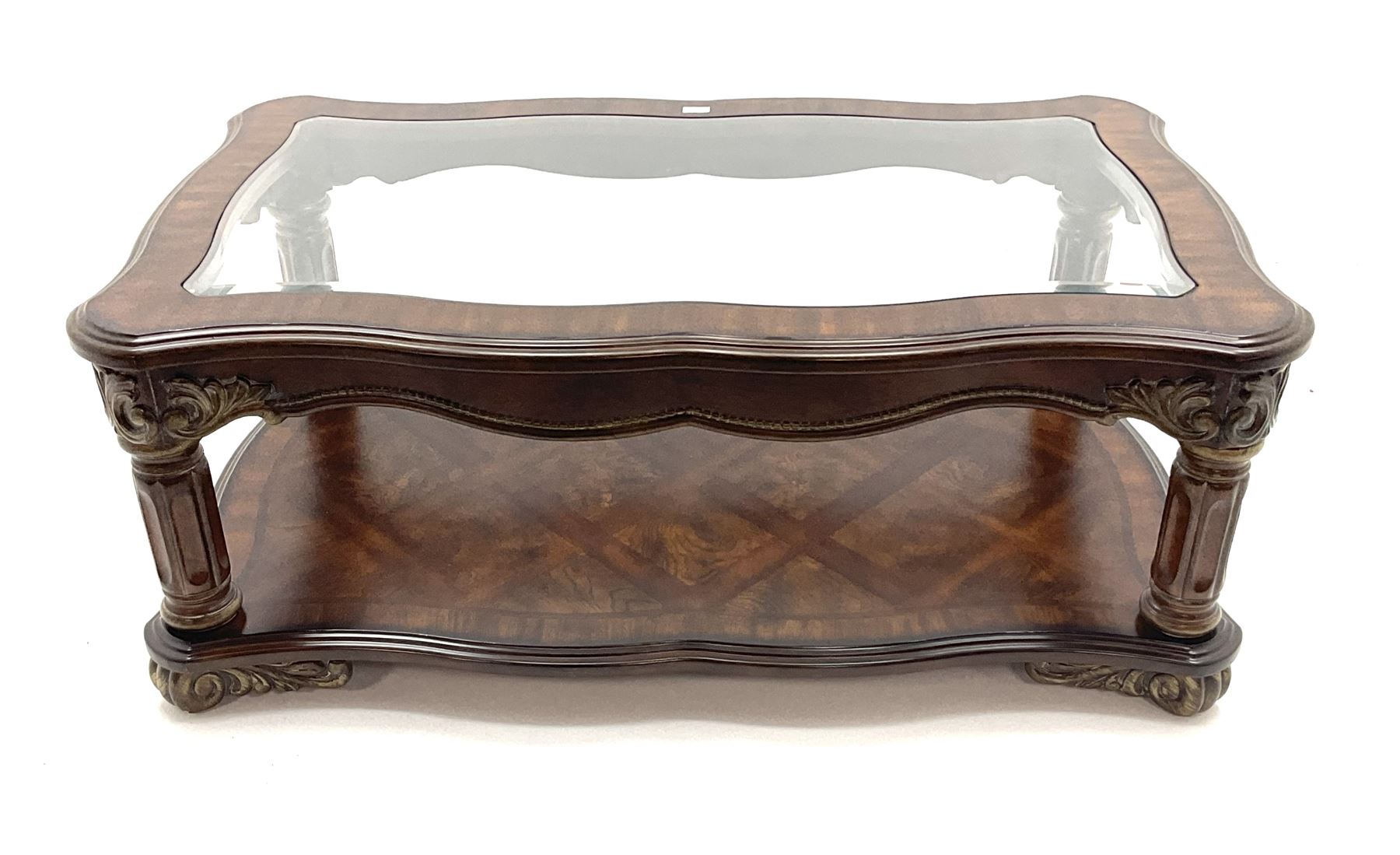 Kevin Charles American walnut rectangular serpentine coffee table , inset glass top, carved column supports joined by undertier 