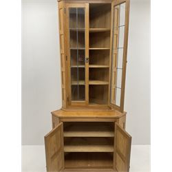 ‘Lizardman’ oak corner cabinet, two lead glazed doors enclosing four shelves, two panelled doors enclosing double cupboard below, by Derek Slater of Crayke