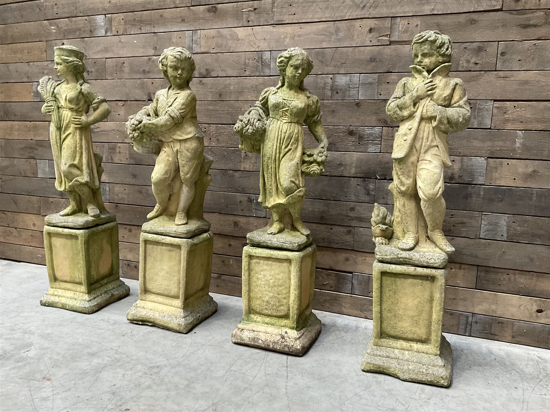 The Four Seasons - set of four cast stone garden figures on plinths