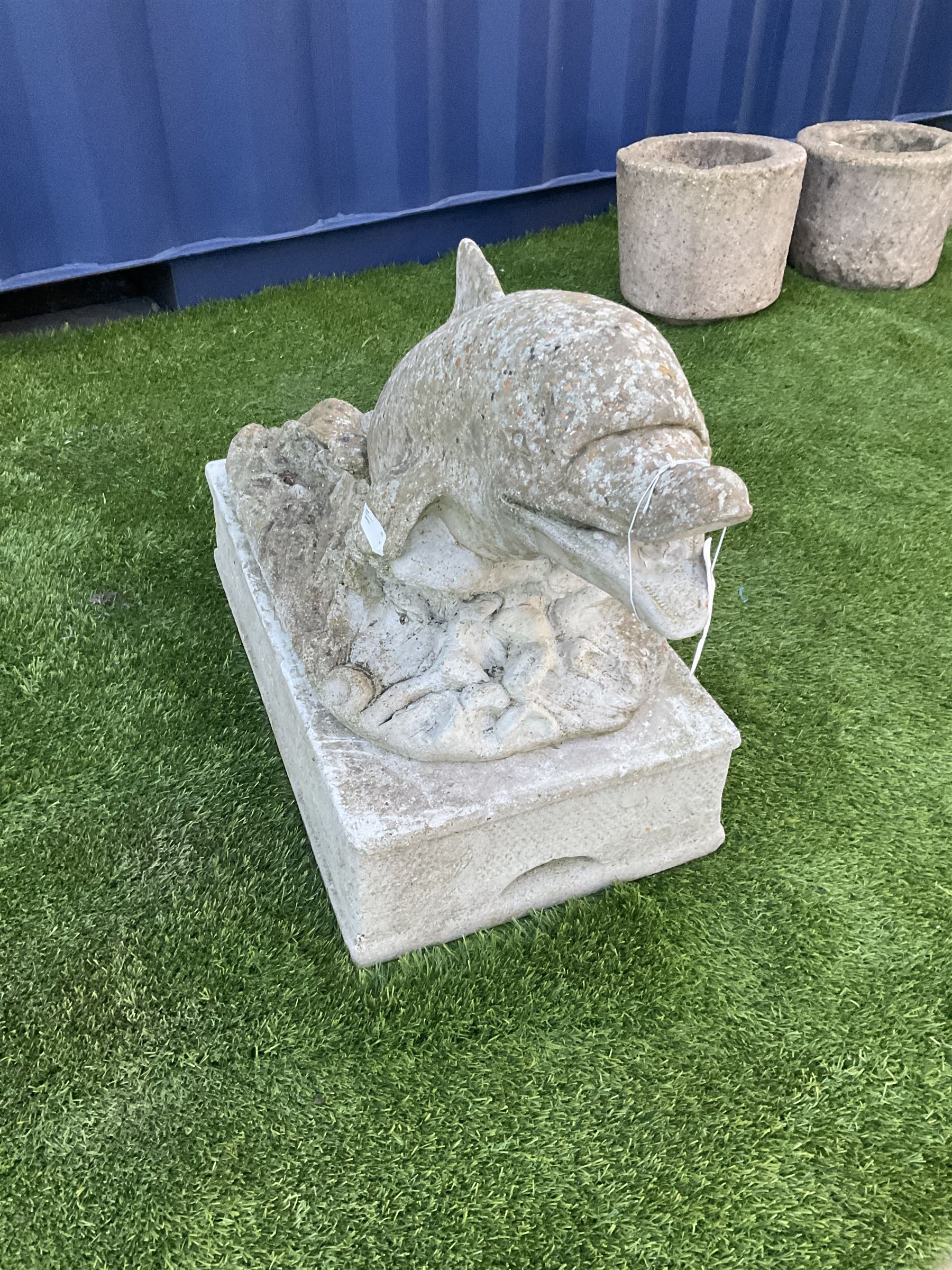 Composite stone dolphin garden ornament, on plinth  - THIS LOT IS TO BE COLLECTED BY APPOINTMENT FROM DUGGLEBY STORAGE, GREAT HILL, EASTFIELD, SCARBOROUGH, YO11 3TX