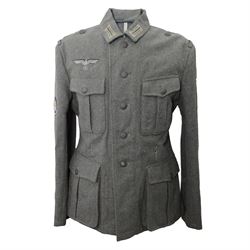 WWII German Third Reich field tunic, with Edelweiss insignia to the sleeve, eagle with swa...