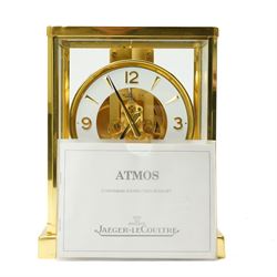 Jaeger- LeCoultre Atmos clock No.291241, with white dial in brass and five glass case and outer carrying case with instruction booklet and original receipt dated 1970 H22cm