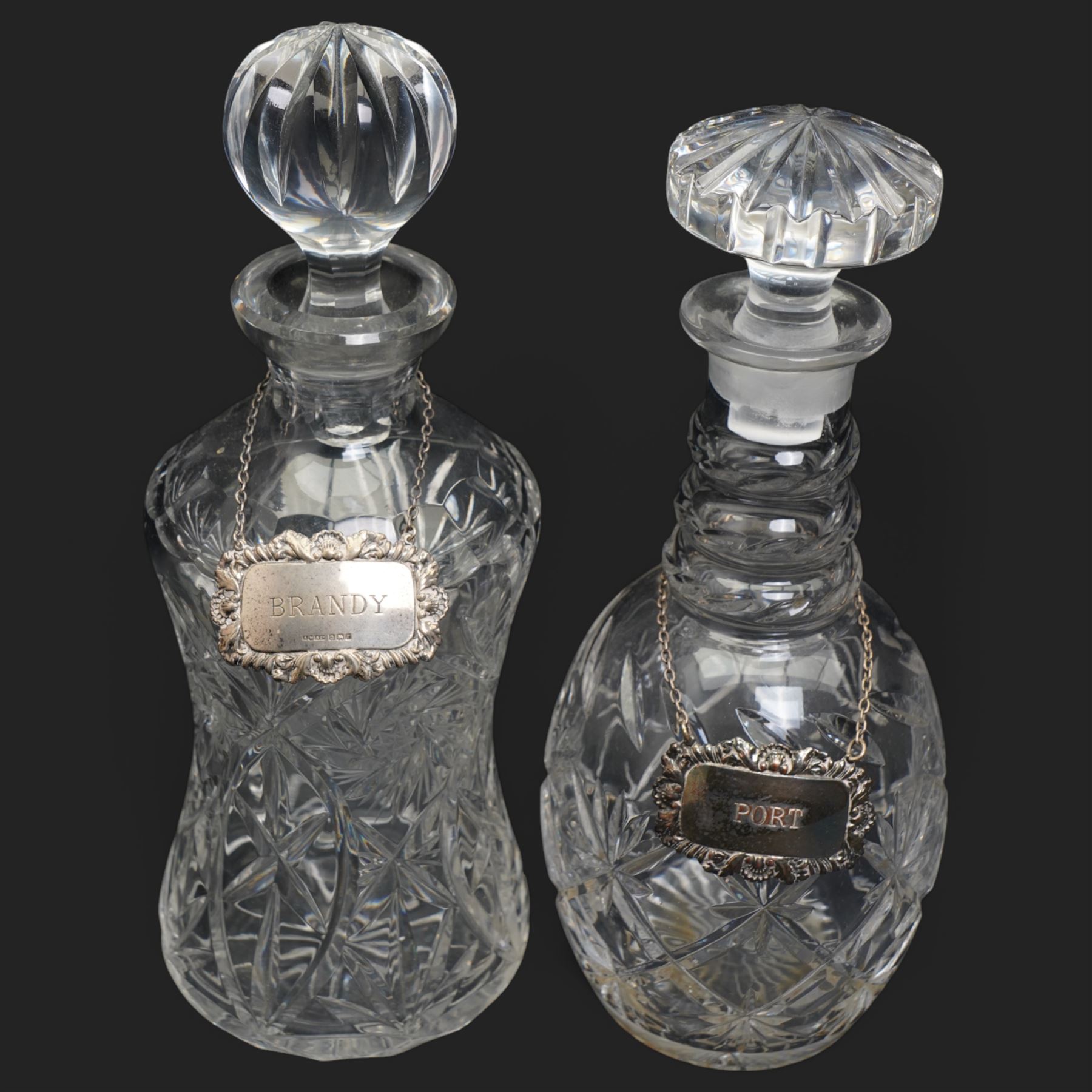 Six crystal decanters, four with silver labels and one with silver plated mount, and one etched glass dinner bell, tallest H30cm 