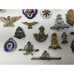 Over thirty military and sweetheart brooches/badges, including RASC, RA, RAFVR, RAF, RN, Durham Light Infantry, Essex Regt., Royal Berks, Highland Light Infantry, Knitted Garments for RN, The Queens etc; some with enamelled decoration
